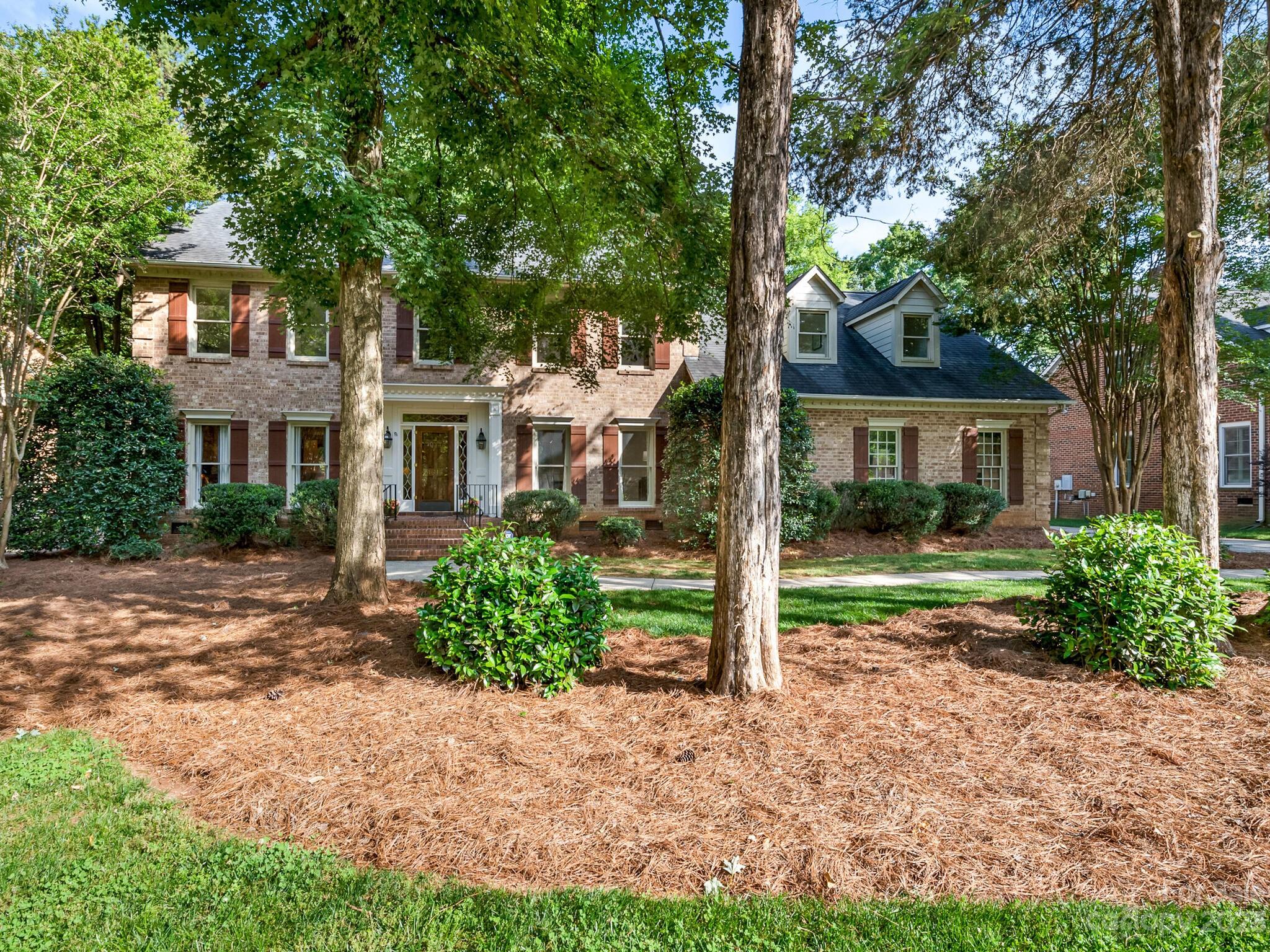 4615 Nora's Path Road Charlotte, NC 28226 - Photo 1 of 34 a front view of a house with garden