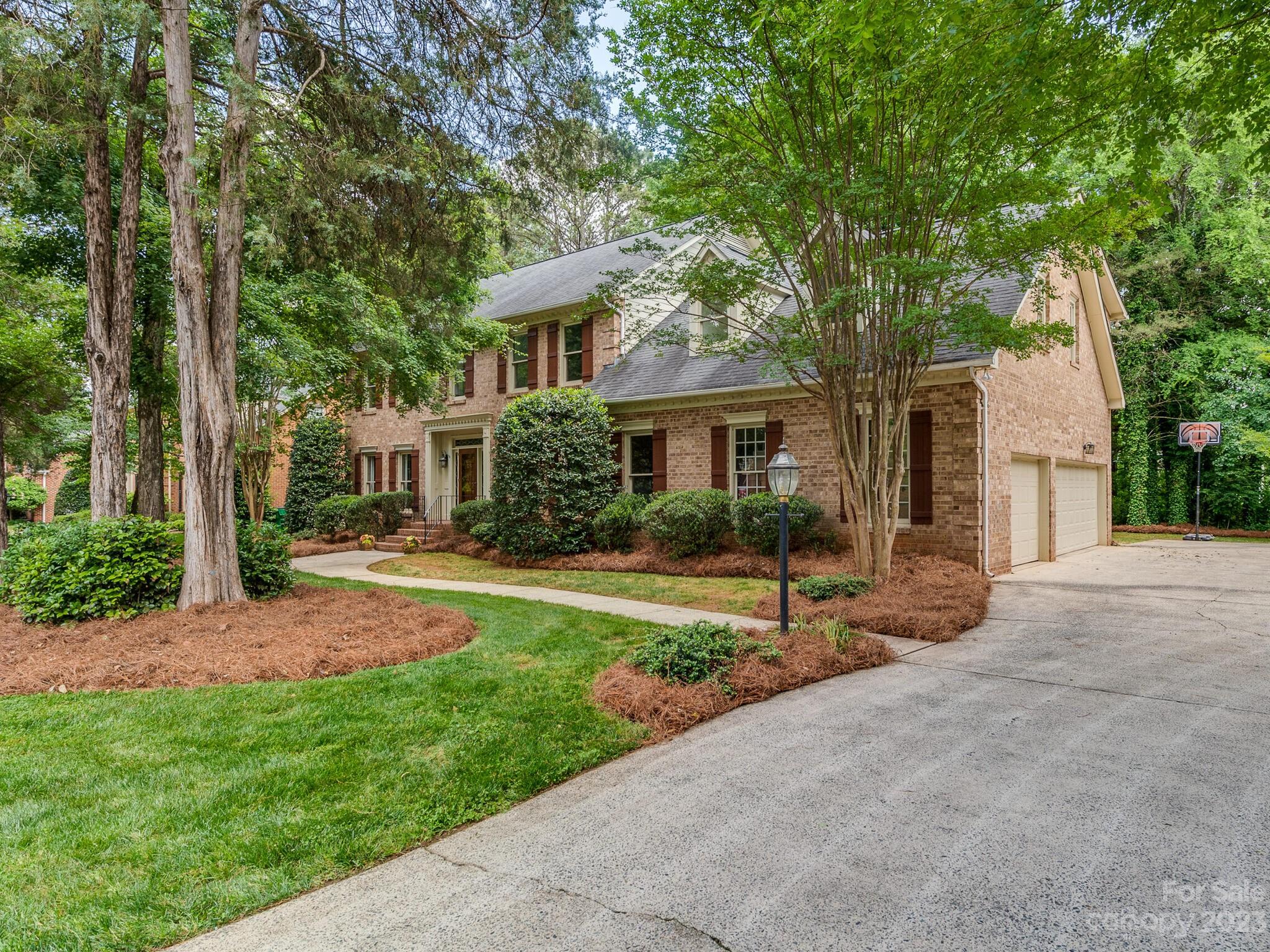 4615 Nora's Path Road Charlotte, NC 28226 - Photo 2 of 34 a view of a house with backyard and a tree