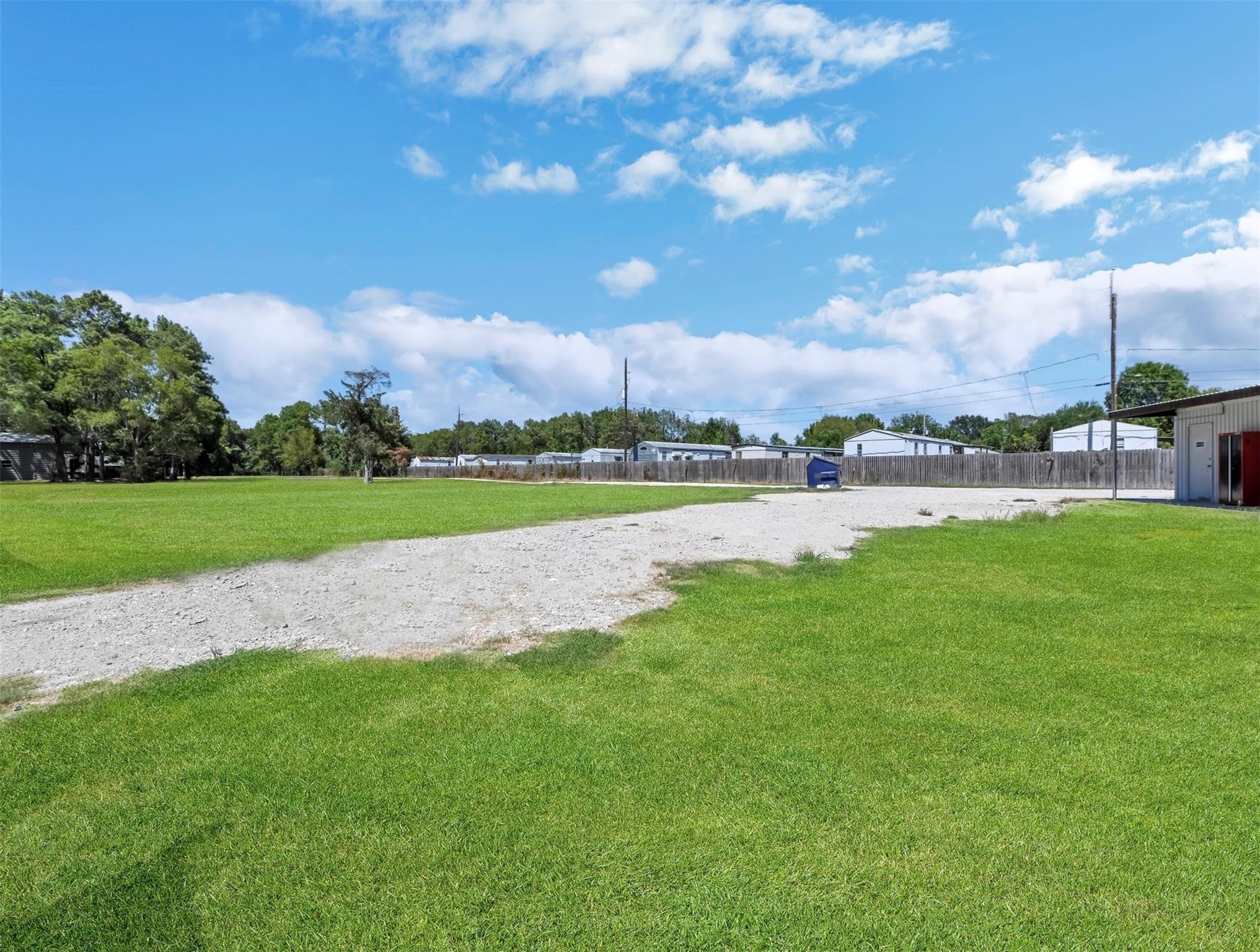 215 Reidland Road Crosby, TX 77532 - Photo 19 of 37 a view of a lake with houses in the background
