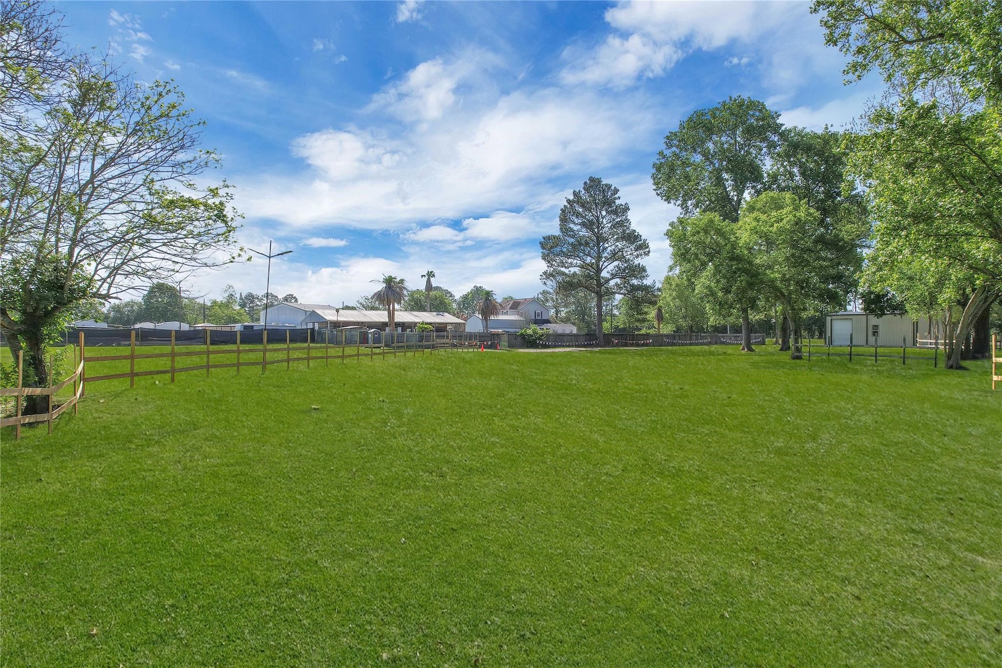 215 Reidland Road Crosby, TX 77532 - Photo 29 of 37 a view of yard with swimming pool and green space