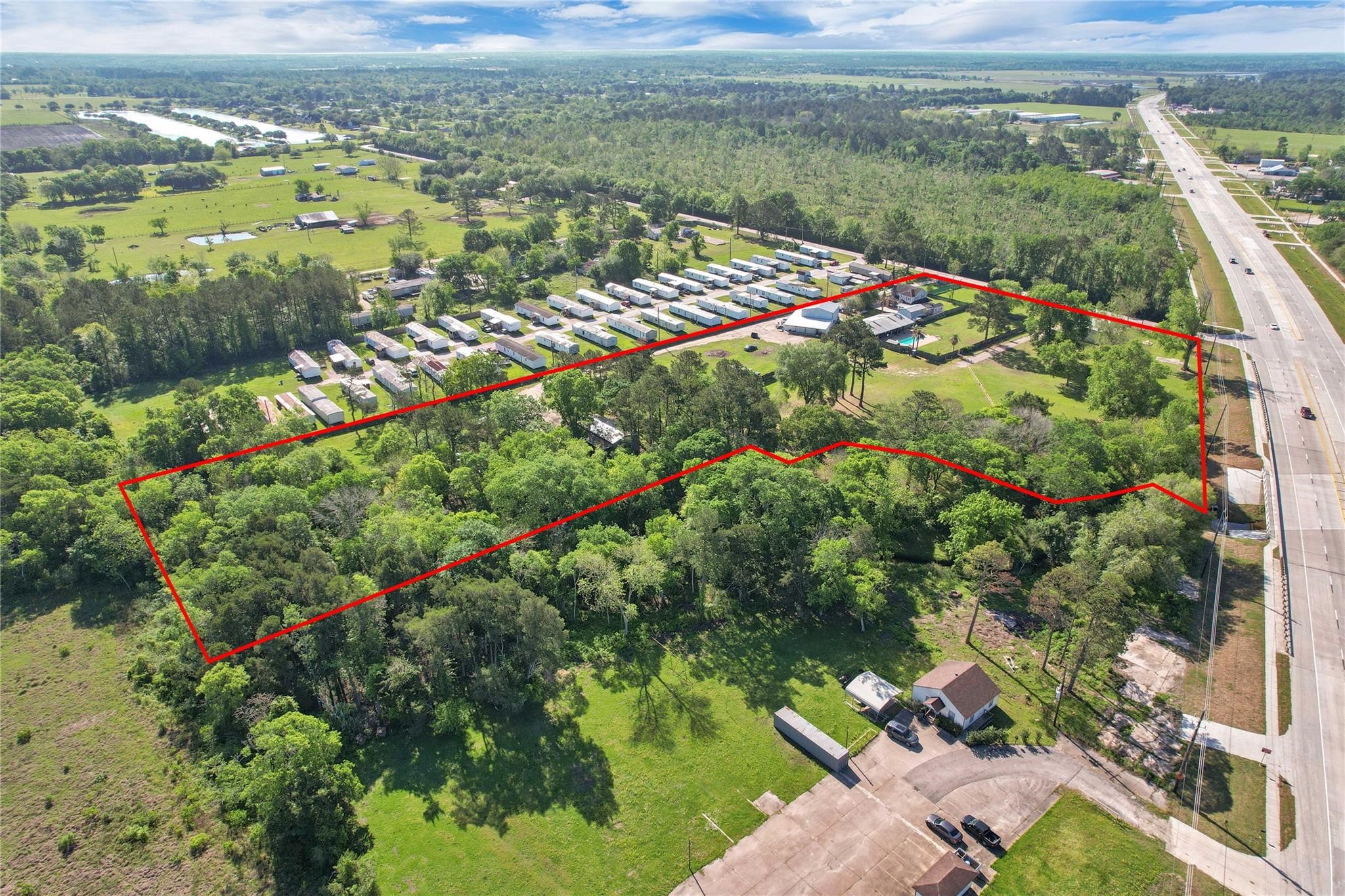 215 Reidland Road Crosby, TX 77532 - Photo 32 of 37 a view of a lake with a city