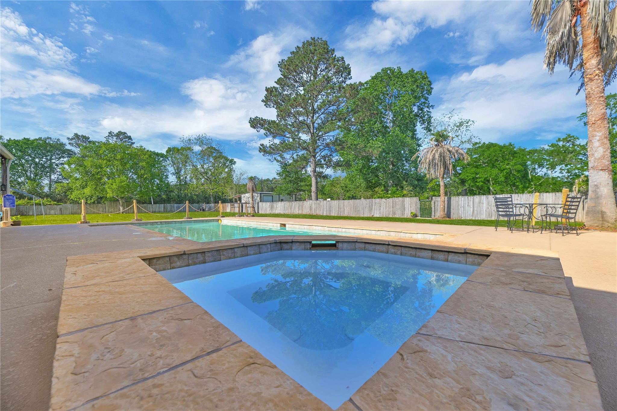 215 Reidland Road Crosby, TX 77532 - Photo 33 of 37 a view of a swimming pool and a yard