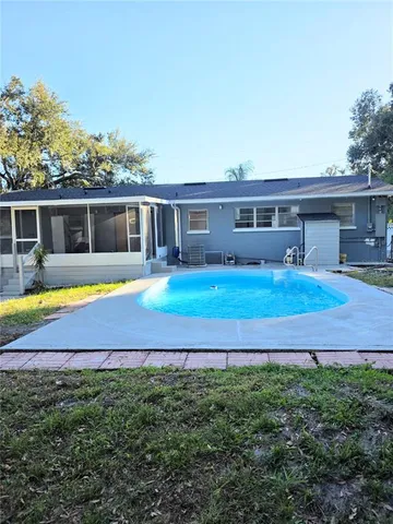 a view of swimming pool with an outdoor space and seating area