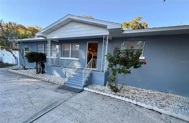a front view of a house with a porch