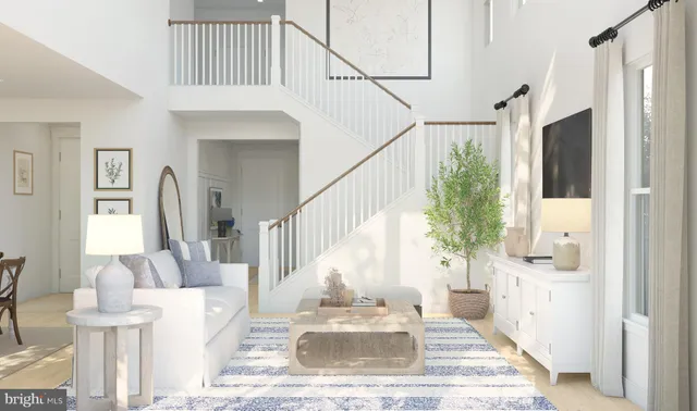 a view of an entryway with wooden floor and a living room