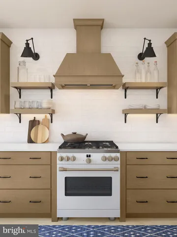 a stove top oven sitting inside of a kitchen