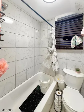 a bathroom with a sink toilet and mirror