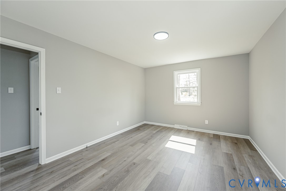 15412 Exter Mill Road Chesterfield, VA 23838 - Photo 50 of 66 Unfurnished room featuring baseboards and light wo