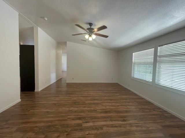 190 Private Road 4435 Rhome, TX 76078 - Photo 11 of 29 a view of empty room with wooden floor and fan