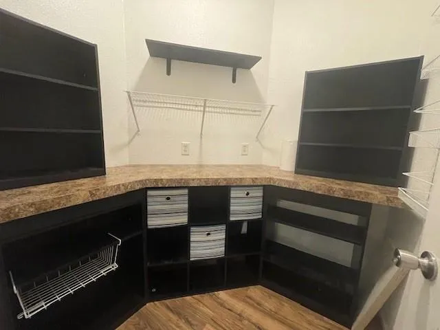 a kitchen with granite countertop a stove and a microwave