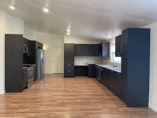 190 Private Road 4435 Rhome, TX 76078 - Photo 13 of 29 a kitchen with stainless steel appliances granite countertop a refrigerator and a sink