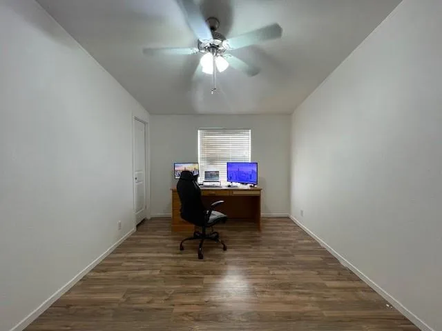 a workspace room with furniture