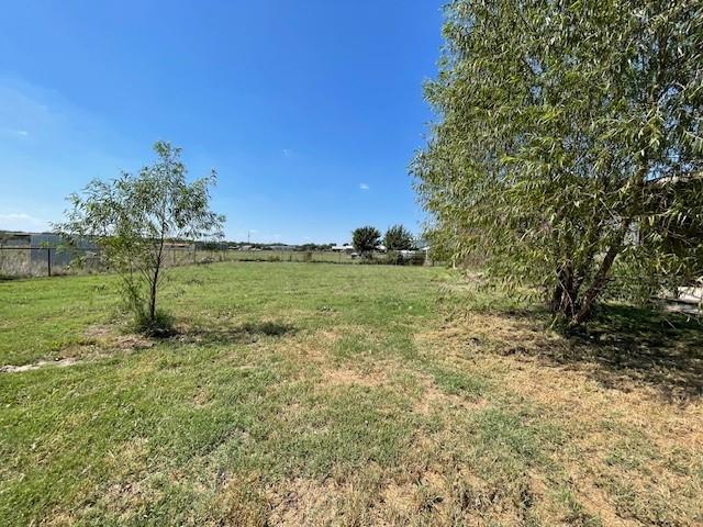 190 Private Road 4435 Rhome, TX 76078 - Photo 26 of 29 a view of a field with an trees