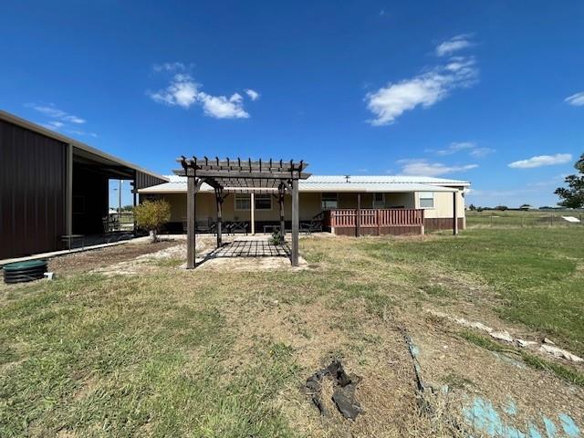190 Private Road 4435 Rhome, TX 76078 - Photo 27 of 29 a backyard of a house with table and chairs