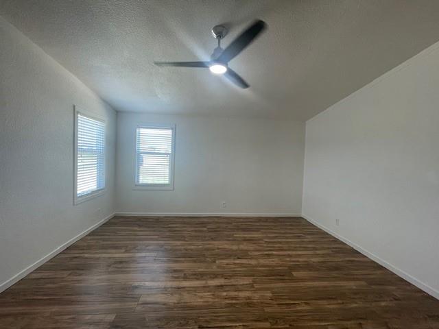 190 Private Road 4435 Rhome, TX 76078 - Photo 6 of 29 wooden floor in an empty room with a window