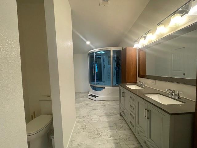 190 Private Road 4435 Rhome, TX 76078 - Photo 7 of 29 a bathroom with a double vanity sink toilet and shower