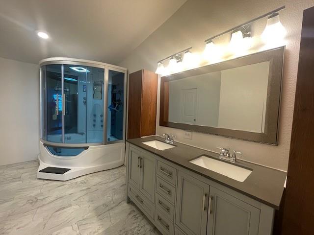 190 Private Road 4435 Rhome, TX 76078 - Photo 9 of 29 workspace with double vanity sink and a mirror