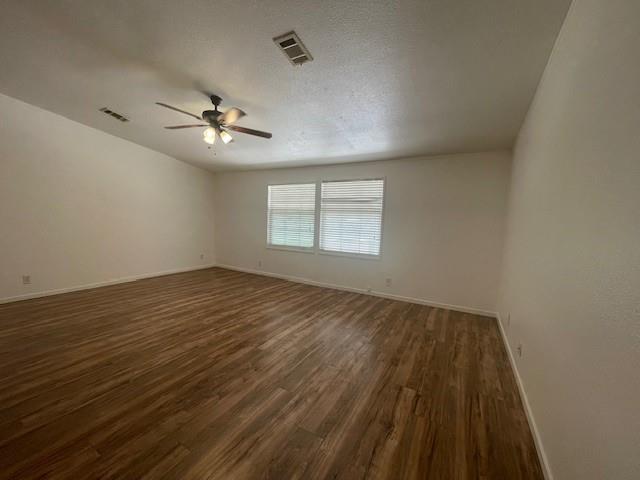 190 Private Road 4435 Rhome, TX 76078 - Photo 10 of 29 wooden floor in an empty room with a window