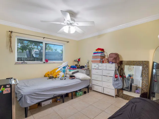 a bed room with a bed and a window