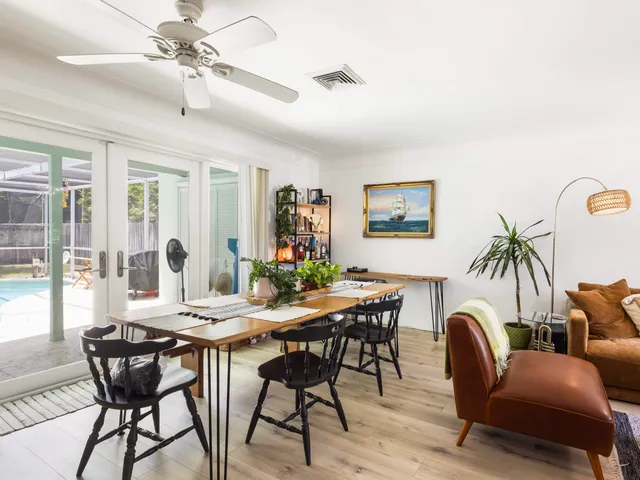 a view of a dining room with furniture window and wooden floor