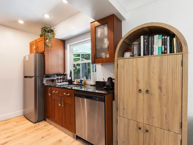 a kitchen with stainless steel appliances a refrigerator and a sink
