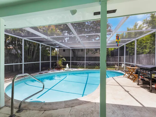 a view of a chair and table in the patio