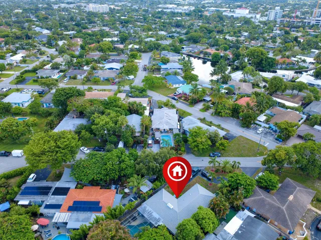 an aerial view of a house with a garden and plants