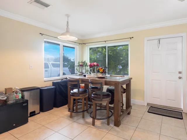 a view of a dining room with furniture window and outside view
