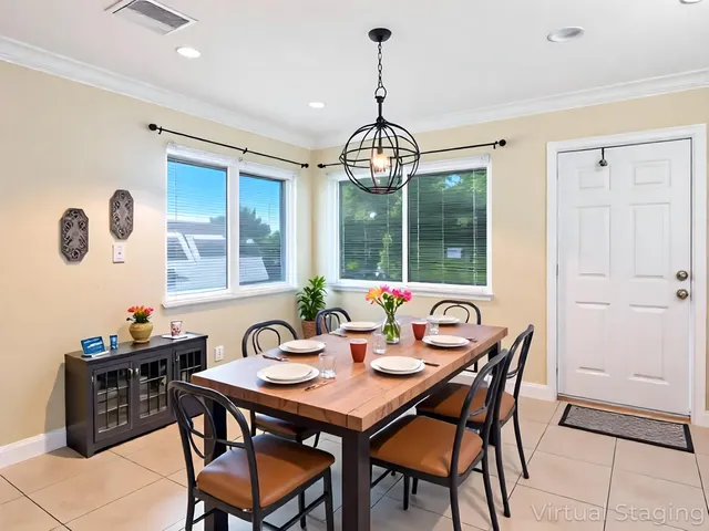 a view of a dining room with furniture window and outside view
