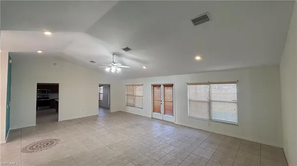 a large kitchen with stainless steel appliances lots of counter top space