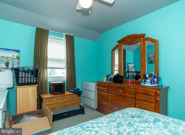 a room with furniture and mirror