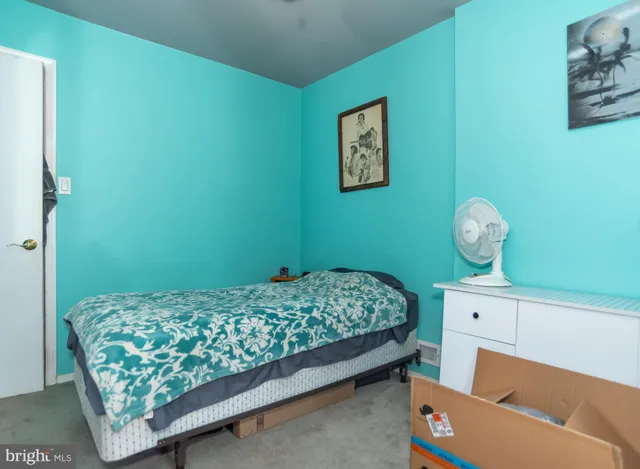 a bedroom with a bed and a table