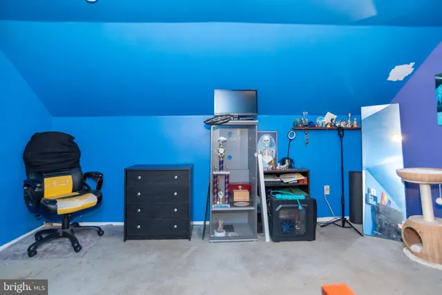 a room with furniture and musical instruments