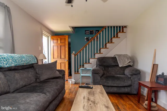 a living room with furniture and a rug