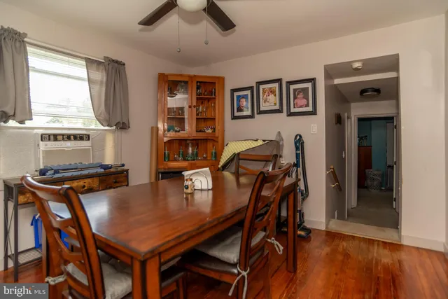 a view of a dining room with furniture and window
