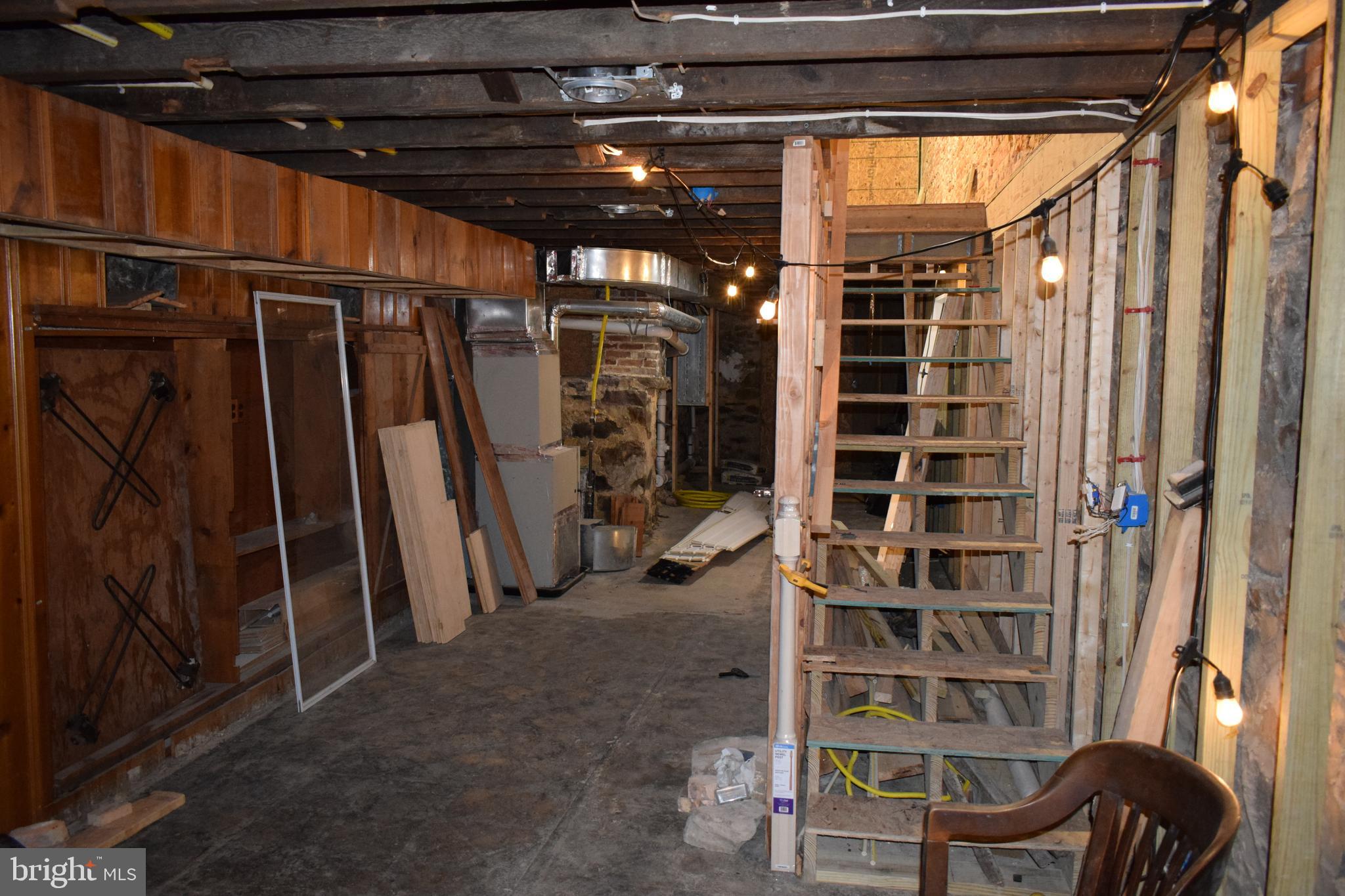 1639 Appleton Street Baltimore, MD 21217 - Photo 14 of 15 a view of walk in closet with clothes and shoes