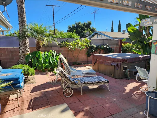 a backyard of a house with outdoor seating