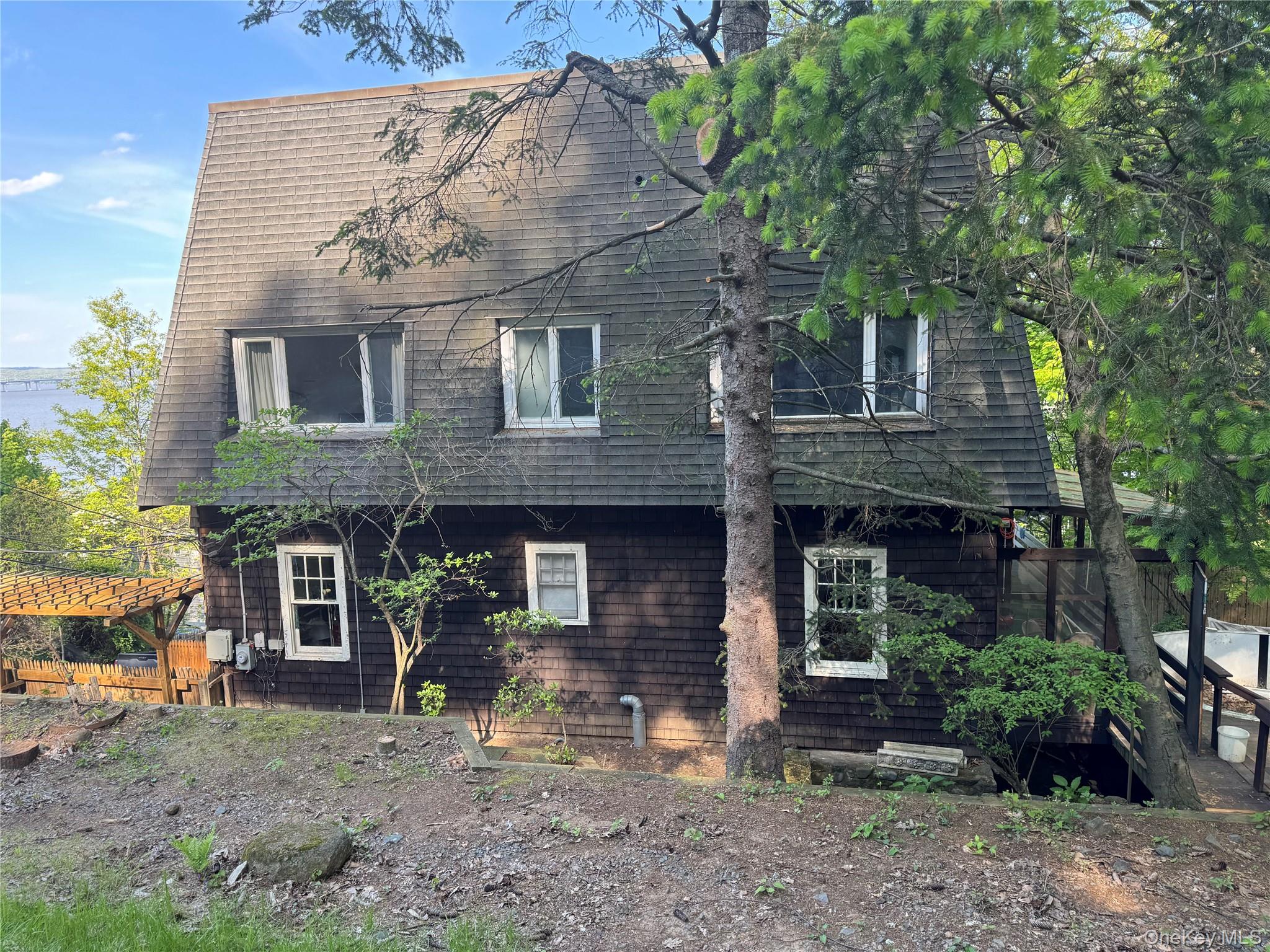 45 Upper Ritie Street Piermont, NY 10968 - Photo 14 of 30 a view of a brick house with a small yard and large tree