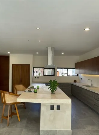 a kitchen with a table and chairs in it