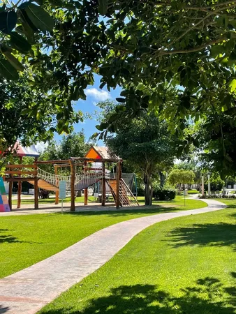 a front view of building with yard and green space