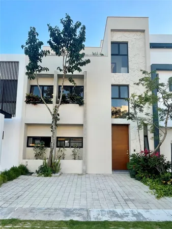 a front view of a house with yard