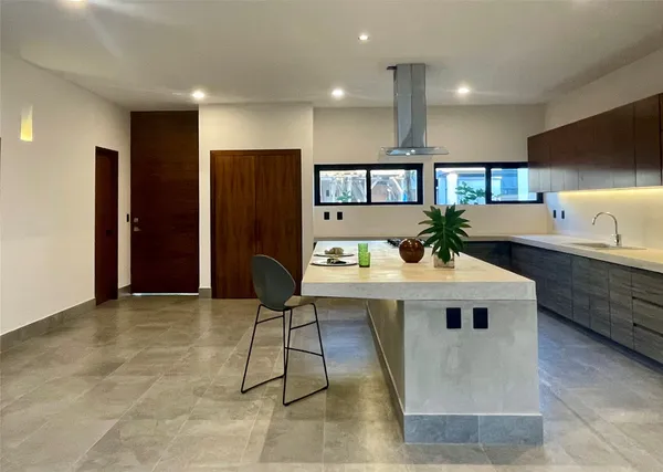 a kitchen with a sink cabinets and stainless steel appliances
