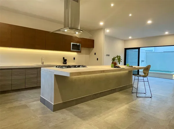 a room with a chair and piano table