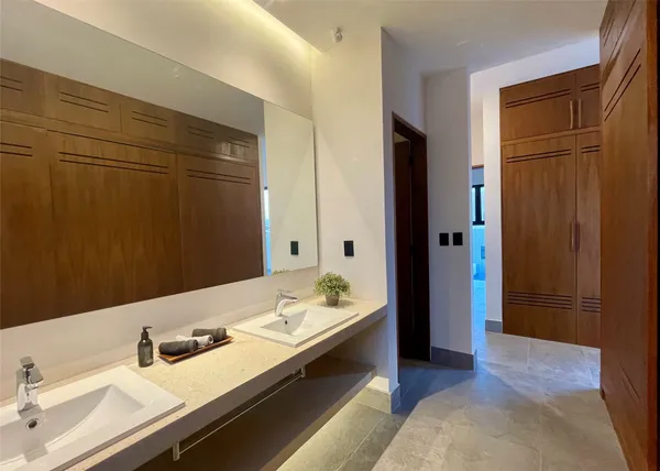 a bathroom with a sink and a mirror