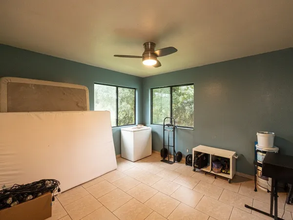 a bedroom with furniture and a window