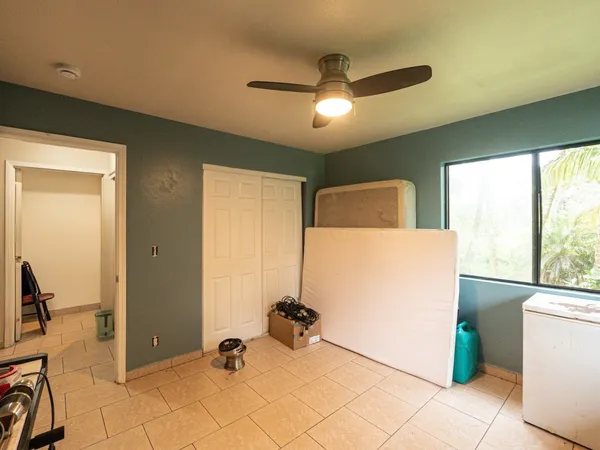 a view of hall way with furniture and a window