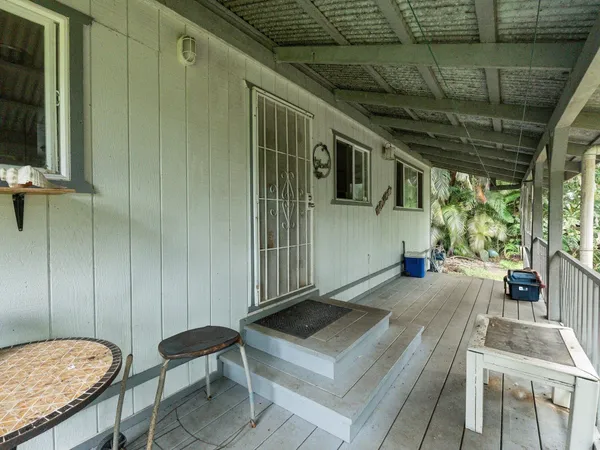 a view of a porch with furniture