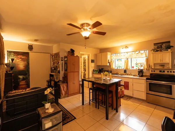 a kitchen with a counter top space appliances and cabinets