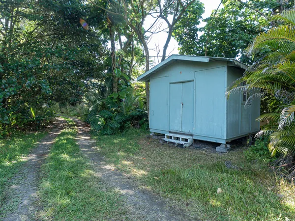 a backyard of a house with lots of green space