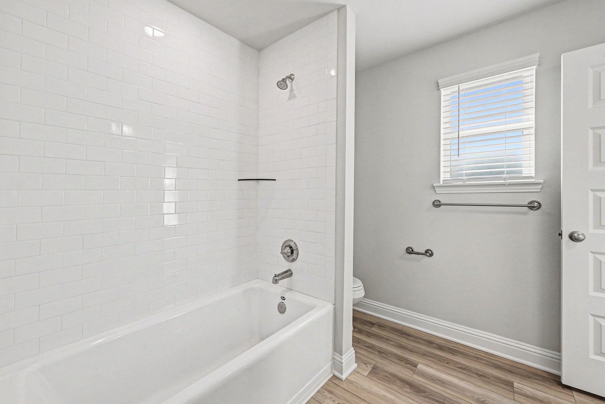 601 Greystone Lane Angleton, TX 77515 - Photo 27 of 32 a bathroom with bathtub and shower